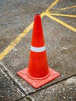 Traffic cone on the asphalt road photo