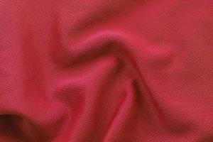 Close up shot of red textured football jersey photo