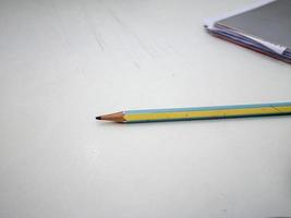 pencil and notebook on office desk photo