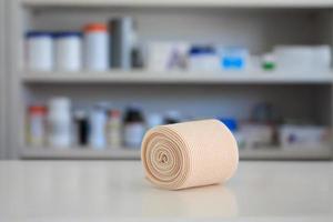 medical elastic bandage with blur shelves of drugstore photo