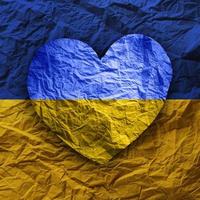 Flag of Ukraine in paper heart shape. Ukrainian national symbol. photo