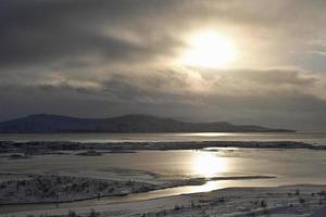 Icelandic lake in nature reserve at sundown photo