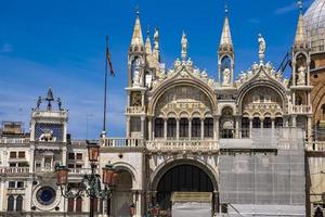 Architectural details from the upper part of facade of San Marco in Venice, Italy photo