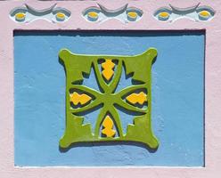 Guatape, Colombia, 2019 - Detail from colorful facade on the building in Guatape, Colombia. Each building in town Guatape has bright color tiles along the lower part of facade. photo