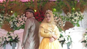 Cianjur Regency West Java Indonesia on June 15, 2021 - A happy couple.  Indonesian Muslim Wedding. photo