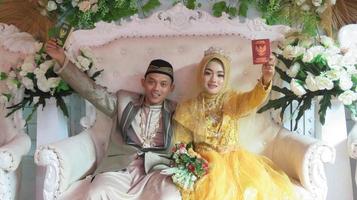 Cianjur Regency West Java Indonesia on June 15, 2021 - A happy couple.  Indonesian Muslim Wedding. photo