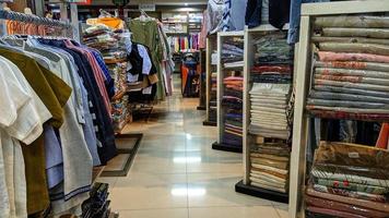 Cianjur Regency, West Java Indonesia on April 7, 2022 - A clothes shop in a supermarket.  Photographing landscapes at night. photo