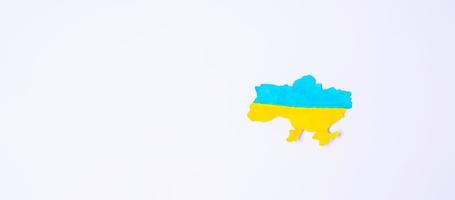 Support for Ukraine in the war with Russia,  the shape of Ukraine border with color flag. Pray, No war, stop war and stand with Ukraine photo