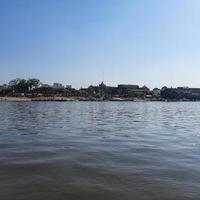 Yamuna River view from the boat in the day at Vrindavan, Krishna temple Kesi Ghat on the banks of the Yamuna River in the town of Vrindavan, Boating at Yamuna River Vrindavan photo
