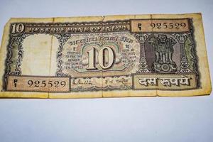Rare Old Indian Ten rupee currency note on white background, Government of India ten rupee old banknote Indian currency, Old Indian Currency note on the table photo