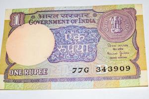 Rare Old Indian One rupee currency note on white background, Government of India one rupee old banknote Indian currency, Old Indian Currency note on the table photo