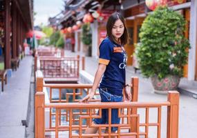 Undefined Asian woman walking and relaxing in touring at huge Golden Dragon Museum in Suphan Buri of Thailand photo