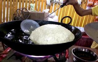 Lucknow, India July 2019, Frying and selling chole bhature at one street shop photo