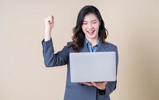 Portrait of young Asian business woman on background photo