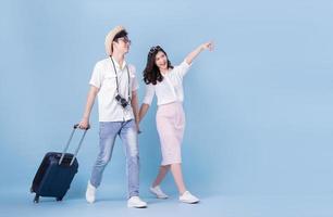 Full length image of young Asian couple travel, summer vacation photo