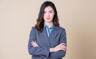 Portrait of young Asian business woman on background photo