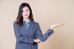 Portrait of young Asian business woman on background photo