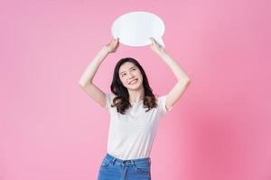 Image of young Asian woman holding message bubble on link background photo