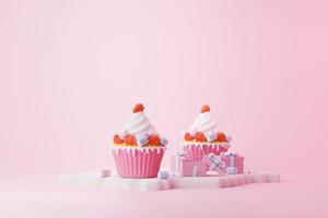 cupcake rosa con fresa roja y pastel de malvavisco puesto con nieve ilustración 3d para celebrar la navidad y el próximo día de san valentín foto