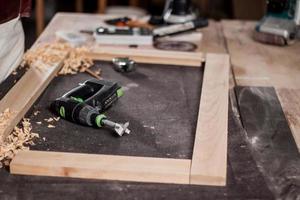 Close up of  carpenter tools on the table in wokshop, woodworking tools photo