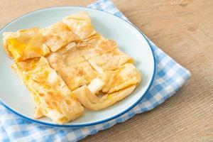 roti with egg and sweetened condensed milk photo