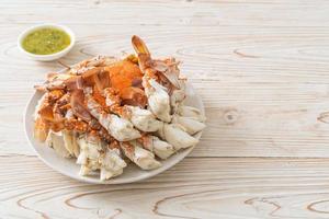 Steamed blue crab with spicy seafood sauce photo