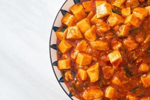 Mapo Tofu - The traditional Sichuan dish of silken tofu and ground beef, packed with mala flavor from chili oil and Sichuan peppercorns. photo