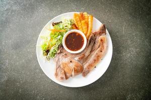 grilled pork chop steak with Thai spicy dipping sauce photo