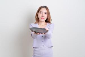 portrait beautiful Asian woman holding empty plate photo