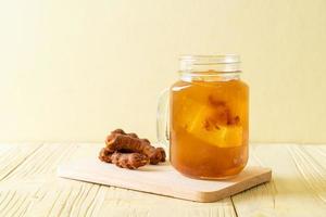 Delicious sweet drink tamarind juice and ice cube photo