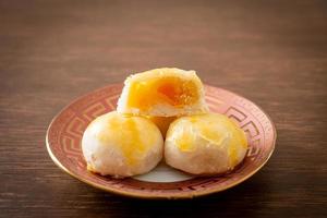 Chinese pastry moon cake with salted egg peanut or Spring Roll pastry with nuts and salted eggs photo