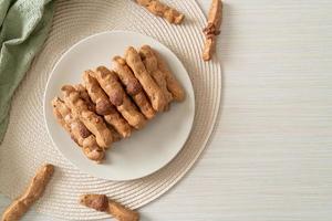 chocolate meringue stick on plate photo