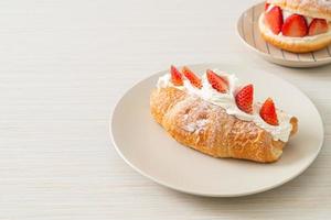 strawberry fresh cream croissant on plate photo