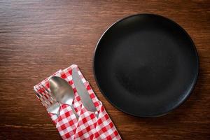 empty plate or dish with knife, fork and spoon photo