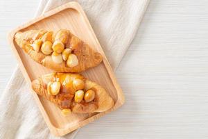 croissant with macadamia and caramel photo