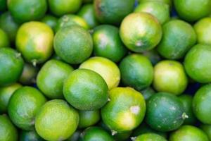 Full frame photo of fresh green lemon for sale in the market