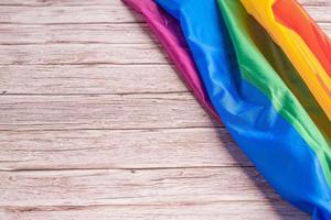 Close-up of LGBT flag on wooden table photo
