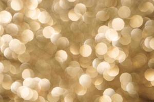 Golden sparkle background with beautiful bokeh photo