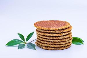 Wafer sprinkled with powder on wooden tray ready to serve photo