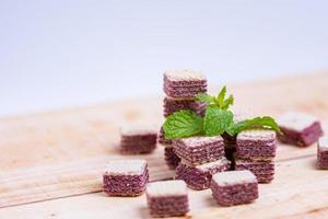 Mint and Candy wafer placed on a wooden table photo