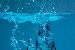 Surface of blue water against white background photo