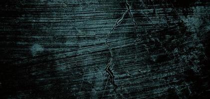 Wall full of scratches. Grungy cement texture for background, Scary dark wall.Black wall photo