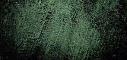 Wall full of scratches. Grungy cement texture for background, Scary dark wall.Black wall photo