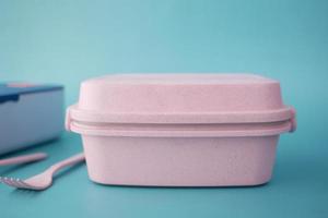 top view of a lunch box on color background photo