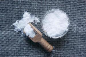 Coarse salt in a bowl on table photo