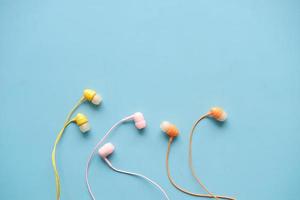 top view of colorful earphone on white background photo