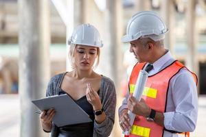 Architect of construction engineer working in construction site and management in the construction site photo