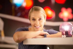 Portrait of women smiling standing against colorful bokeh light photo