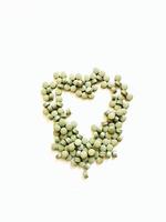 Green herbal vitamins, pills, heart shaped photo