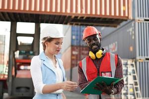 foreman checking containers in the terminal, at import and export business logistic company. photo